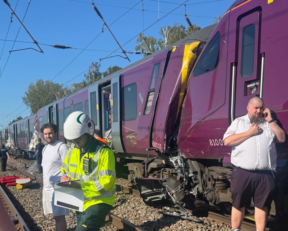 Emergency responders beside damaged trains near Bedford