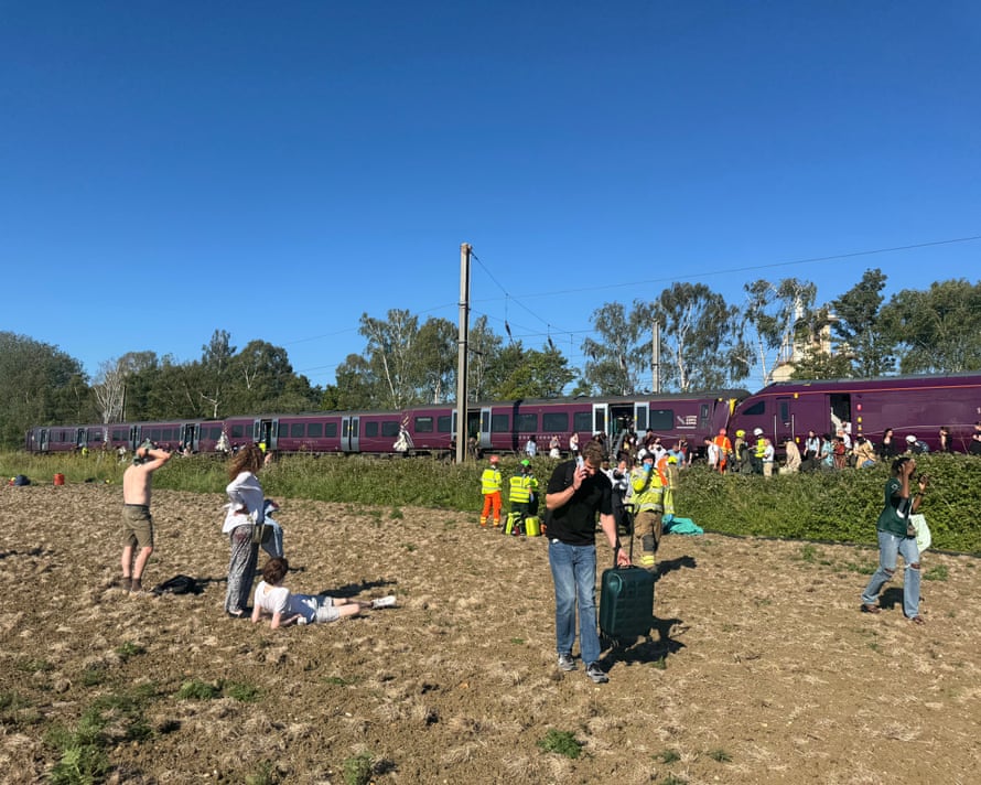 Passengers and responders near the Bedford train collision scene