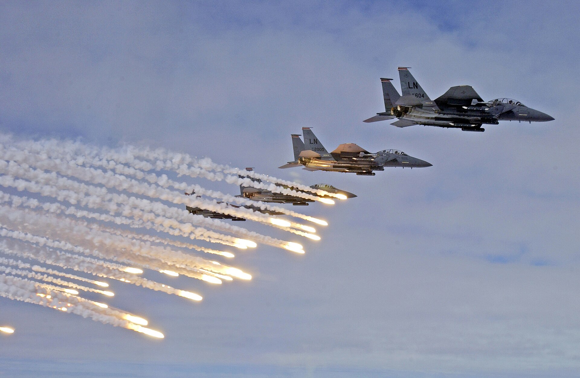 U.S. Air Force F-15E Strike Eagles launch flares during a NATO-linked exercise