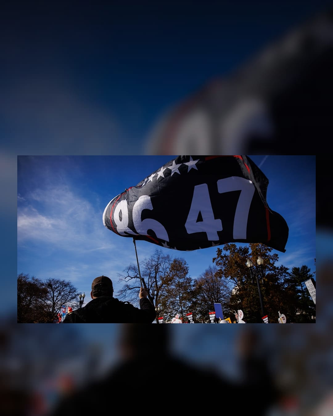 A protester waves an 86-47 flag near the Supreme Court
