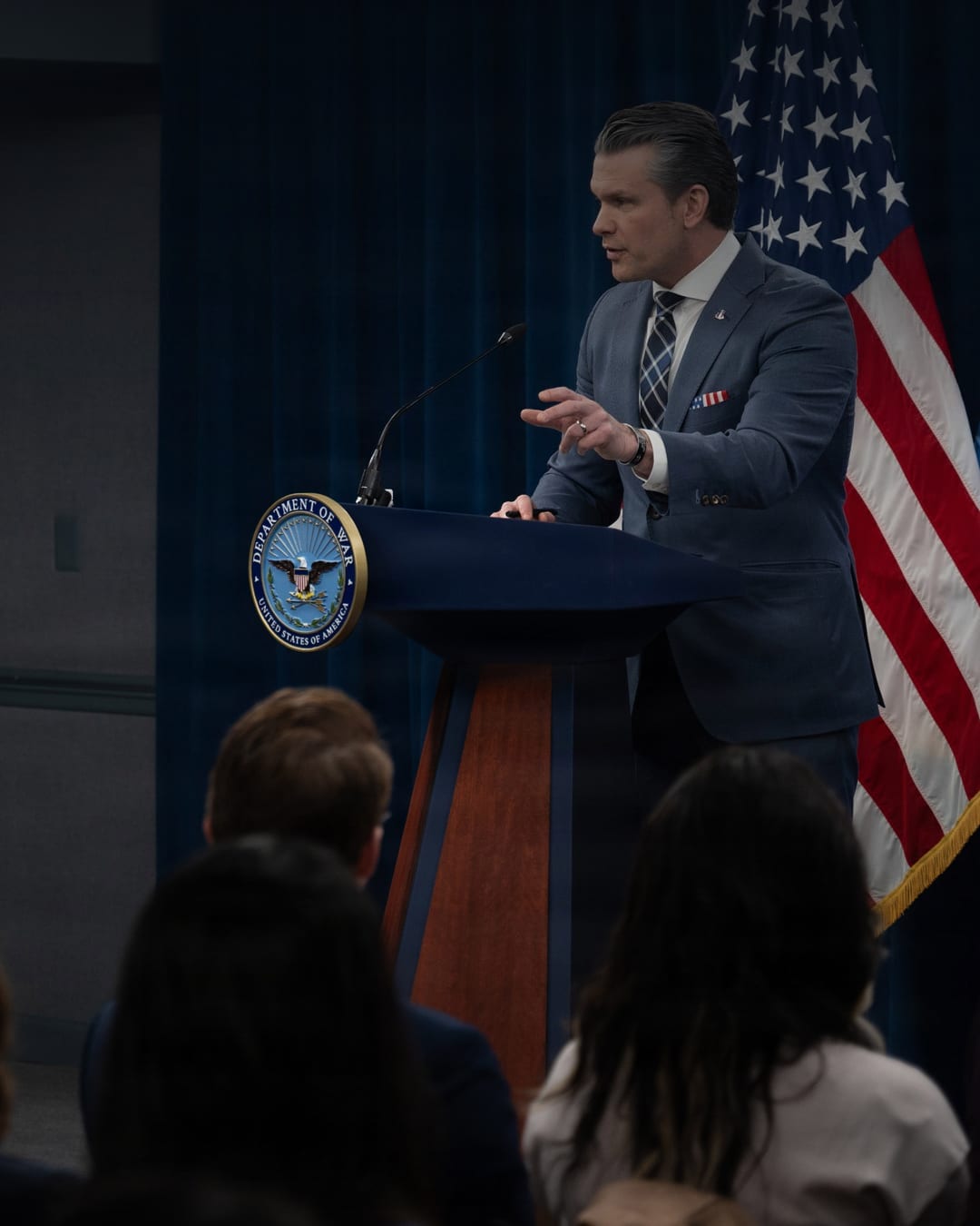 Pete Hegseth speaks at a Pentagon lectern during a March 2026 briefing