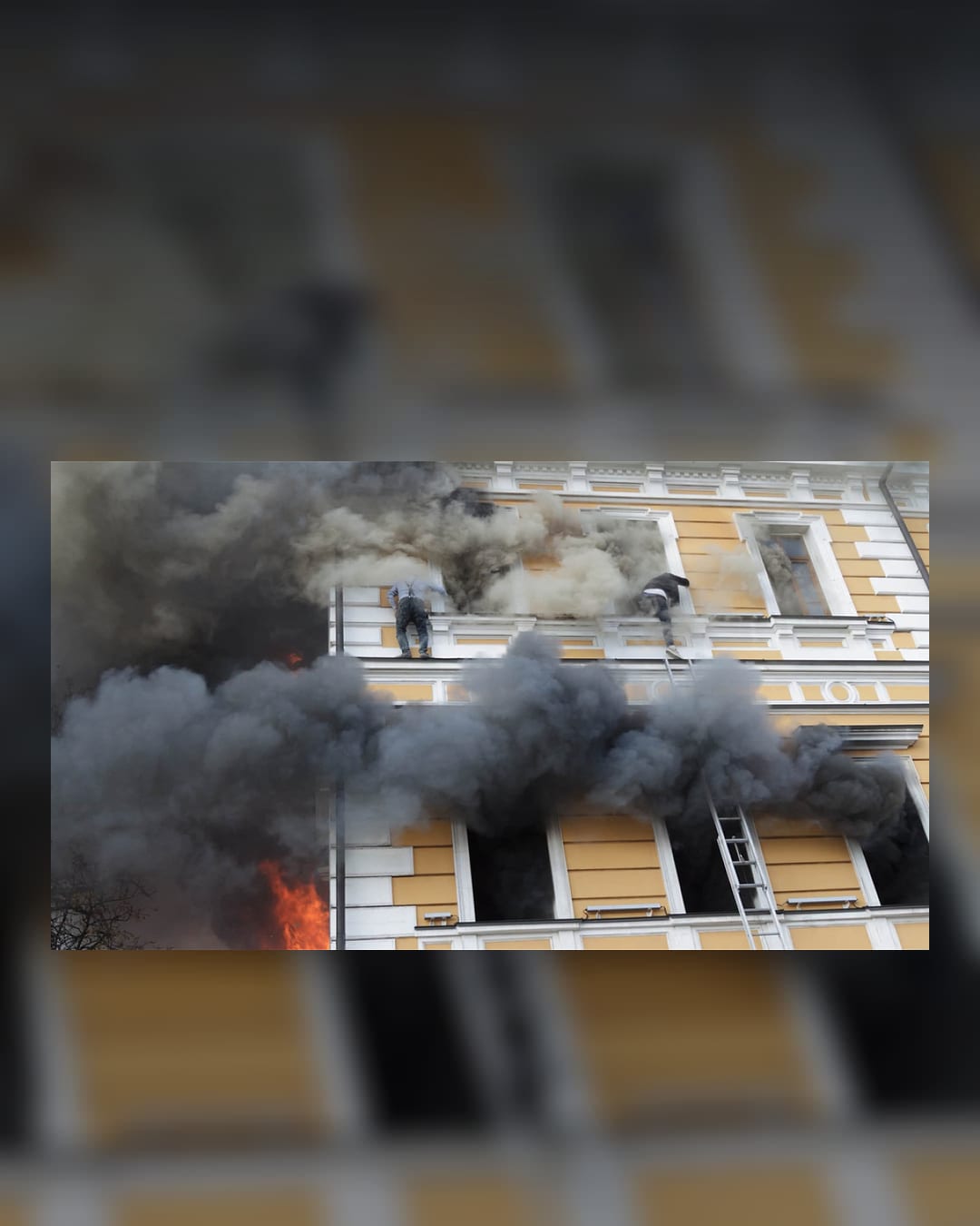 Smoke and emergency activity near a damaged National Academy of Sciences building in central Kyiv after a drone strike.