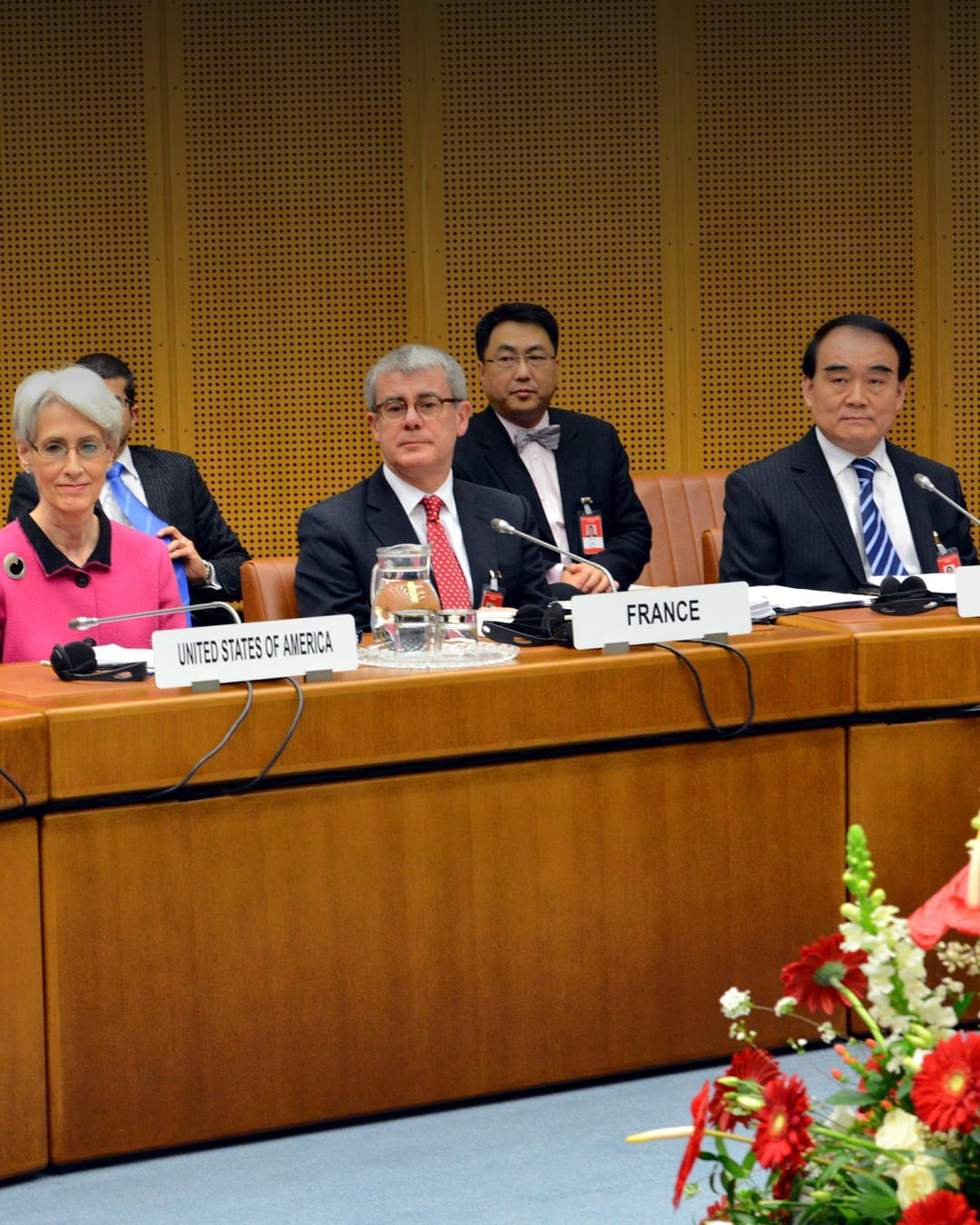 A US delegation sits at a conference table during Iran nuclear talks in Vienna in 2014.