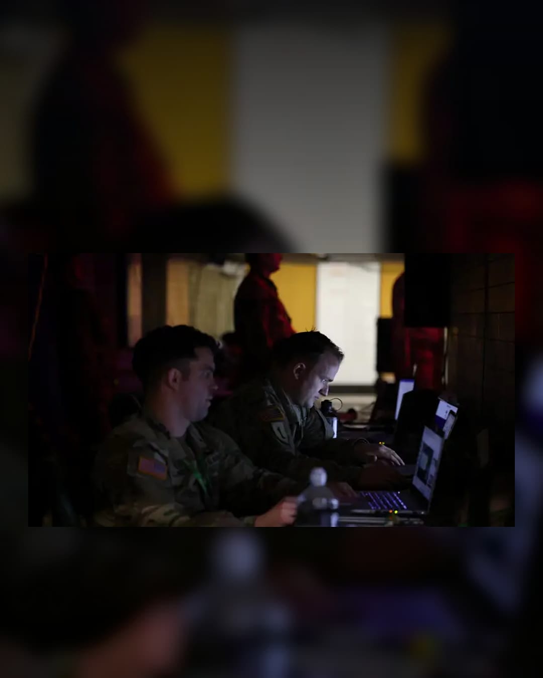 Military personnel work at laptops during Exercise Arrcade Strike beneath Charing Cross station